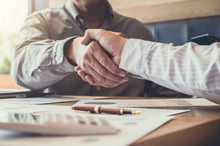 DWI attorney shaking hands with client