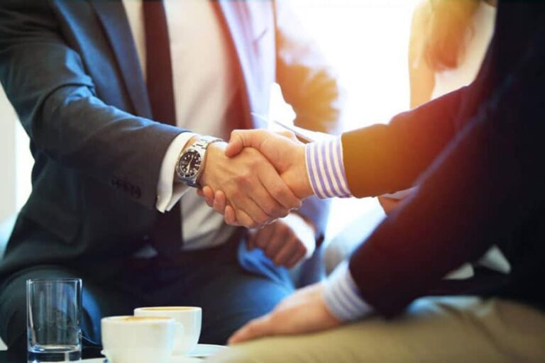 DWI lawyer shaking hands with client