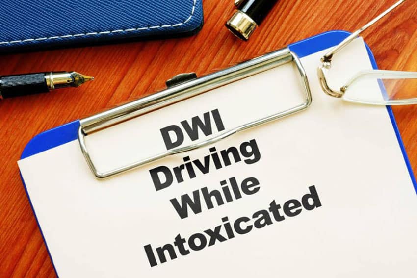 Clipboard that states "DWI Driving While Intoxicated"