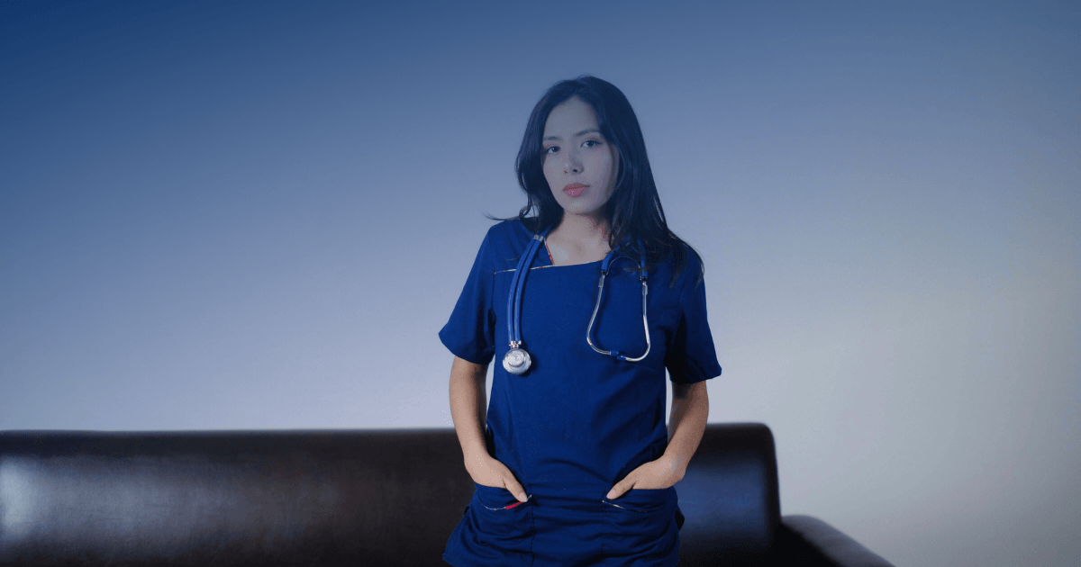 Nurse in scrubs with a stethoscope standing indoors, illustrating how a New York DWI conviction may affect a nursing license.